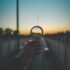 person holding magnifying glass during sunset