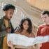 serious young diverse millennials reading map in railway station terminal